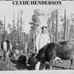 Jesse Clyde Henderson behind the first house he built 1n 1937 with our animals